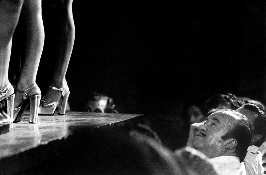 A man watching strippers in a club in Barcelona, 1975