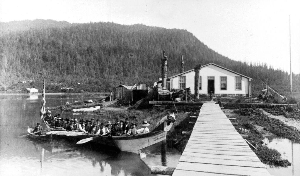Chief Shake's house canoe with Indian Funeral at Ft Wrangel, Alaska, circa 1890.