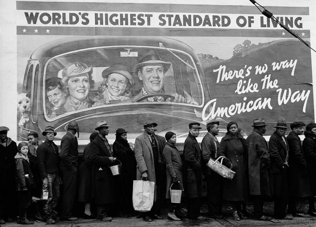 African-Americans displaced by the Great Ohio River Flood line up at a relief station in Louisville, Kentucky. 1937.