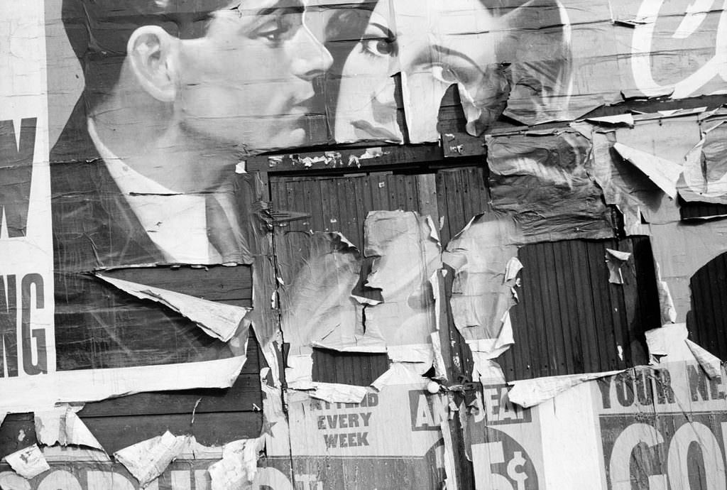 Tattered billboard, Minneapolis, Minnesota. 1939.