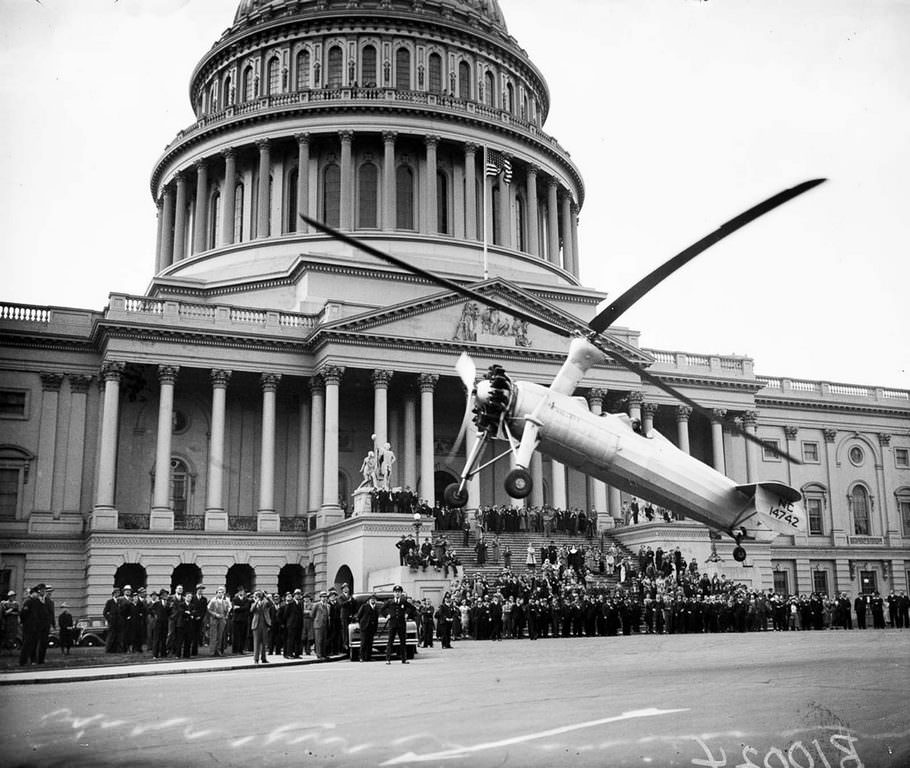 An autogyro takes off in front of the United States Capitol. 1936.