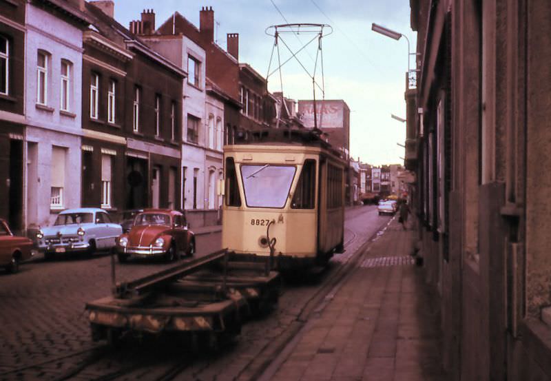 Motorcar 8827 + carts with rail near the stelplaats / depot Merksem, Antwerp.
