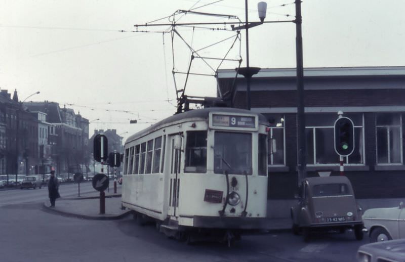 Motorcar 10491 on route Nº 9 leaves the station square on the North side, Mons.