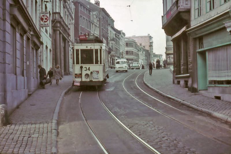 Under the watching eye of the tram driver, the conductor (still wearing the traditional dust coat) is setting the points to the right direction, Roux, 1975
