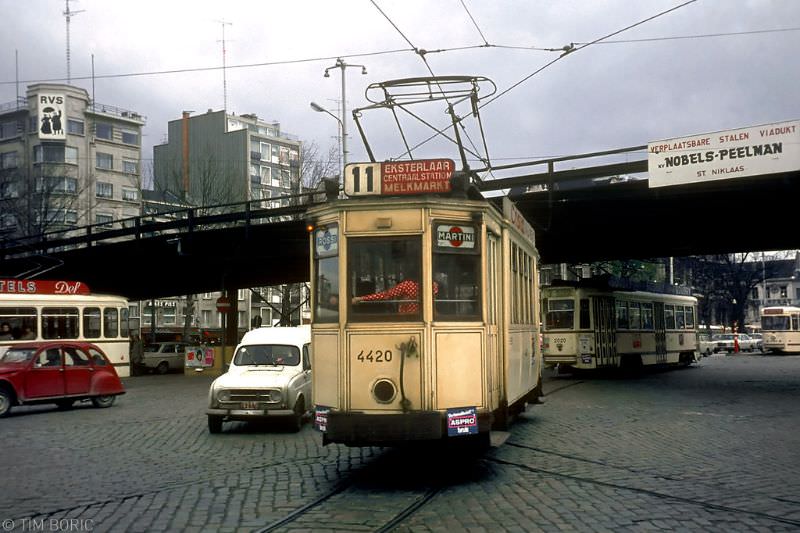 Tram and car traffic under the "removable steel viaduct" that spoiled Rooseveltplaats for so many years. Antwerpen, 1973