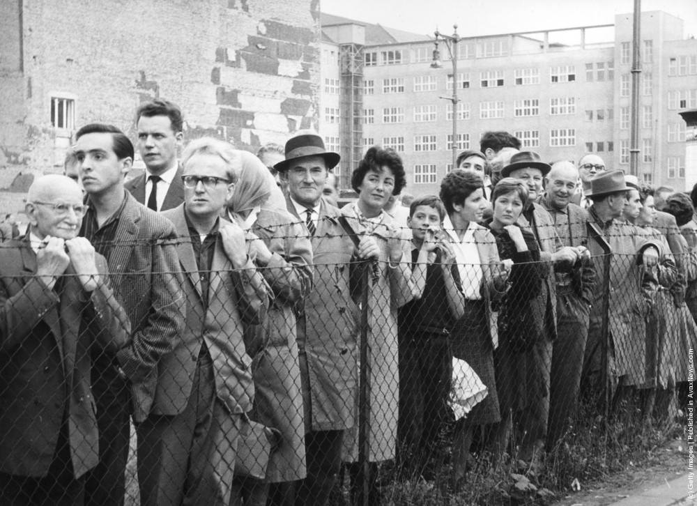 On a day when the Berlin Wall is open, throngs of West Germans wait for friends and relatives to arrive from the Eastern sector, 1960.