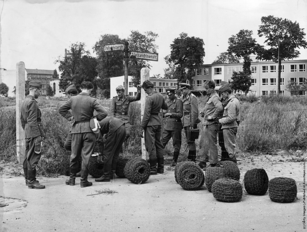 East German troops and police seal off the frontier between East and West Berlin with barbed-wire to control the flow of refugees, 15th August 1961.
