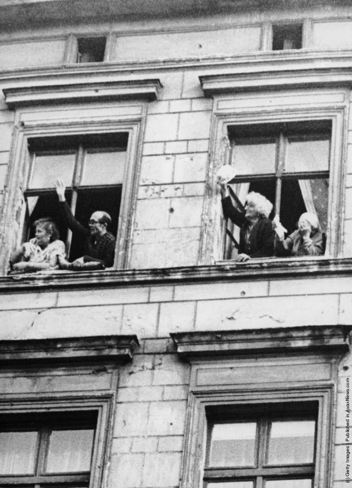 Relatives of newlyweds Dieter and Monika Marotz of Bernauerstrasse, Berlin, wave to the couple after their wedding, 8th September 1961.