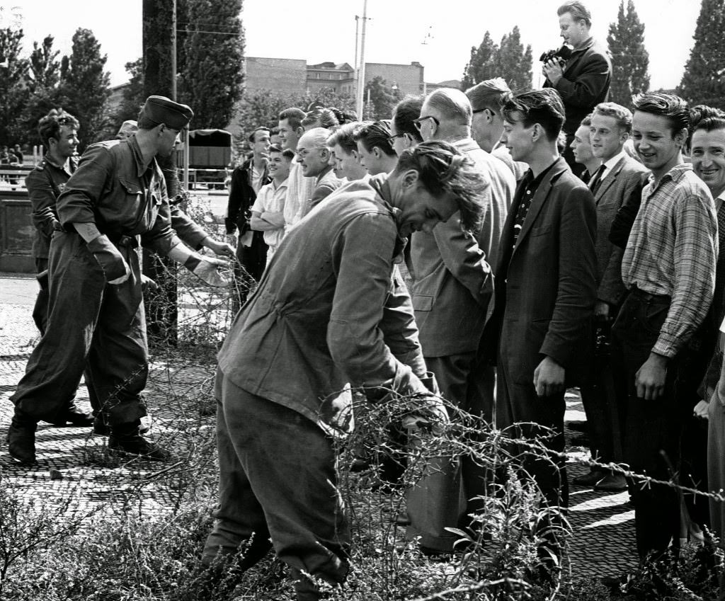 East German soldiers, left, set up barbed wire barricades August , 13, 1961.