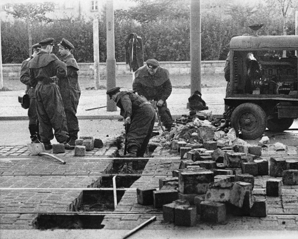 Members of the East German military remove paving blocks on Friedrich Strasse in East Berlin August 13, 1961.