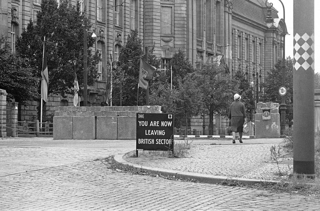 The East Berlin authorities have put their emblems on small flags on the concrete wall at the Invalidenstrasse crossing point between the British and Russian sector border in Berlin on Sept. 9, 1961.