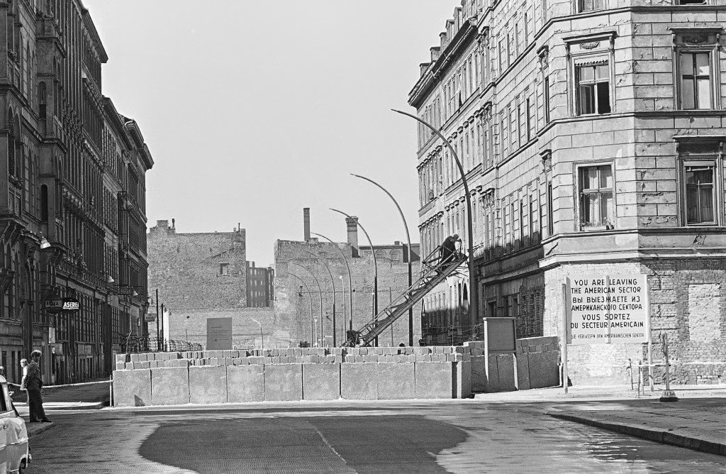 At sector border Sebastian Strasse where the American sector borders the Soviet East Berlin workers erecting strong street lights behind the concrete border wall in Berlin Sept. 19, 1961.