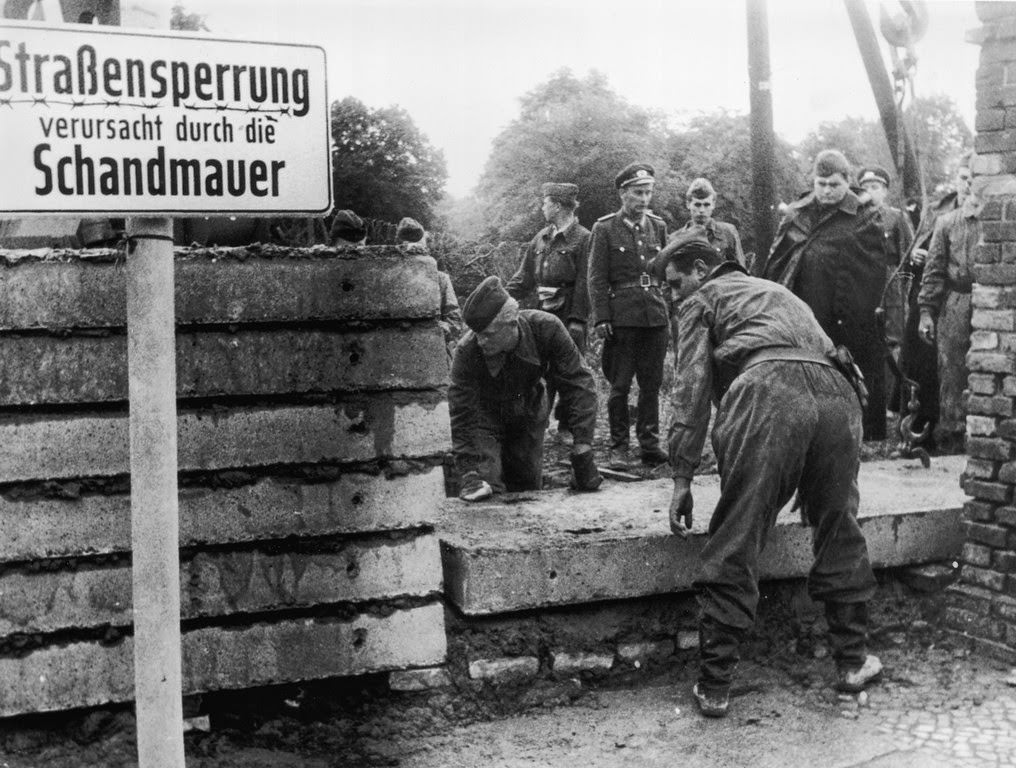 Soldiers building the Berlin Wall as instructed by the East German authorities, in order to strengthen the existing barriers dividing East and West Berlin, 1961.