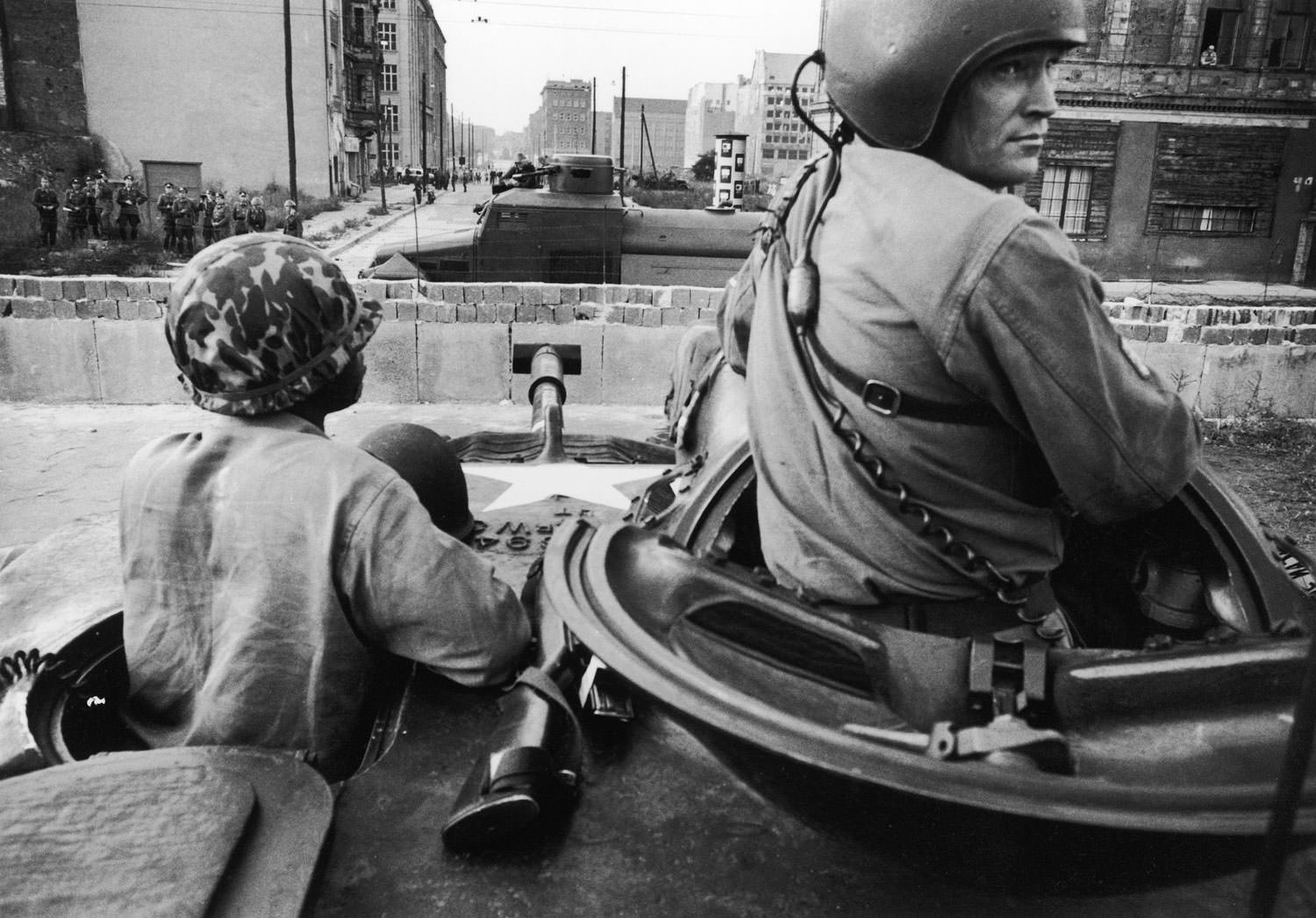 American forces, in foreground, face East German forces across the newly built Berlin Wall in 1961.