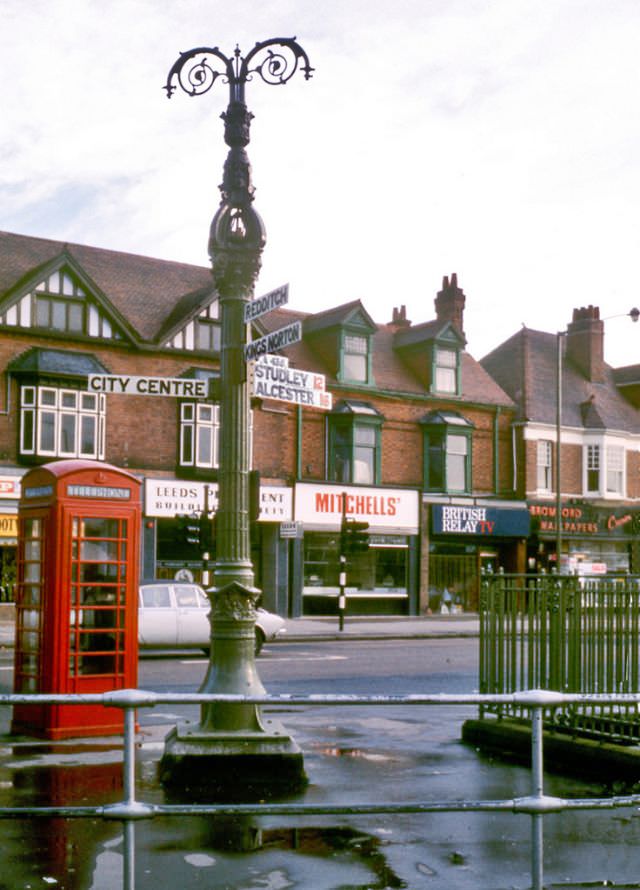 The signpost on the corner of Vicarage Rd. and Alcester Road in Kings Heath, Birmingham