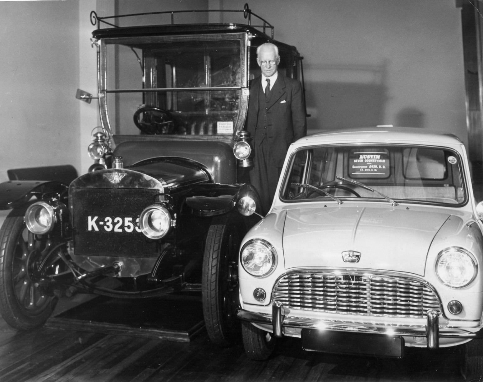 Mr Norwood at Austin Motors with an old car and an Austin Seven Countryman, Birmingham, circa 1960.