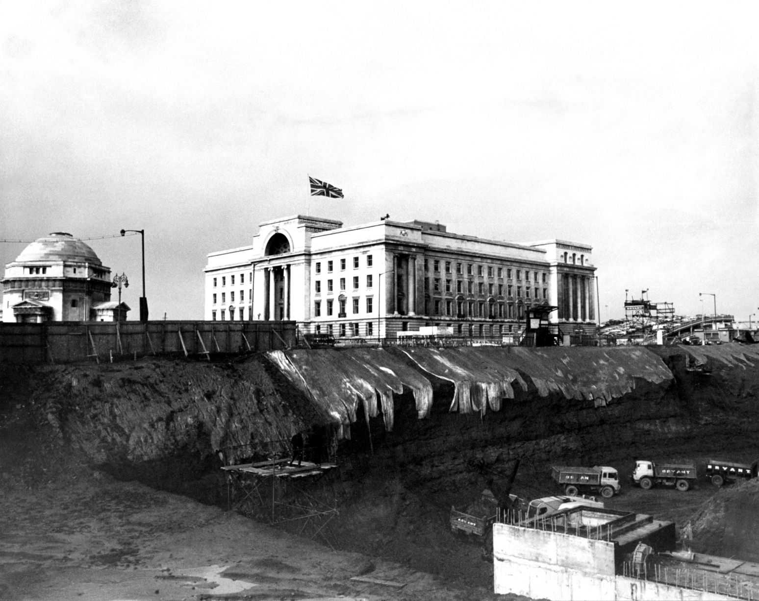 Baskerville House appears precariously perched above the huge hole that will rise Paradise Circus, 10th Sept 1969.