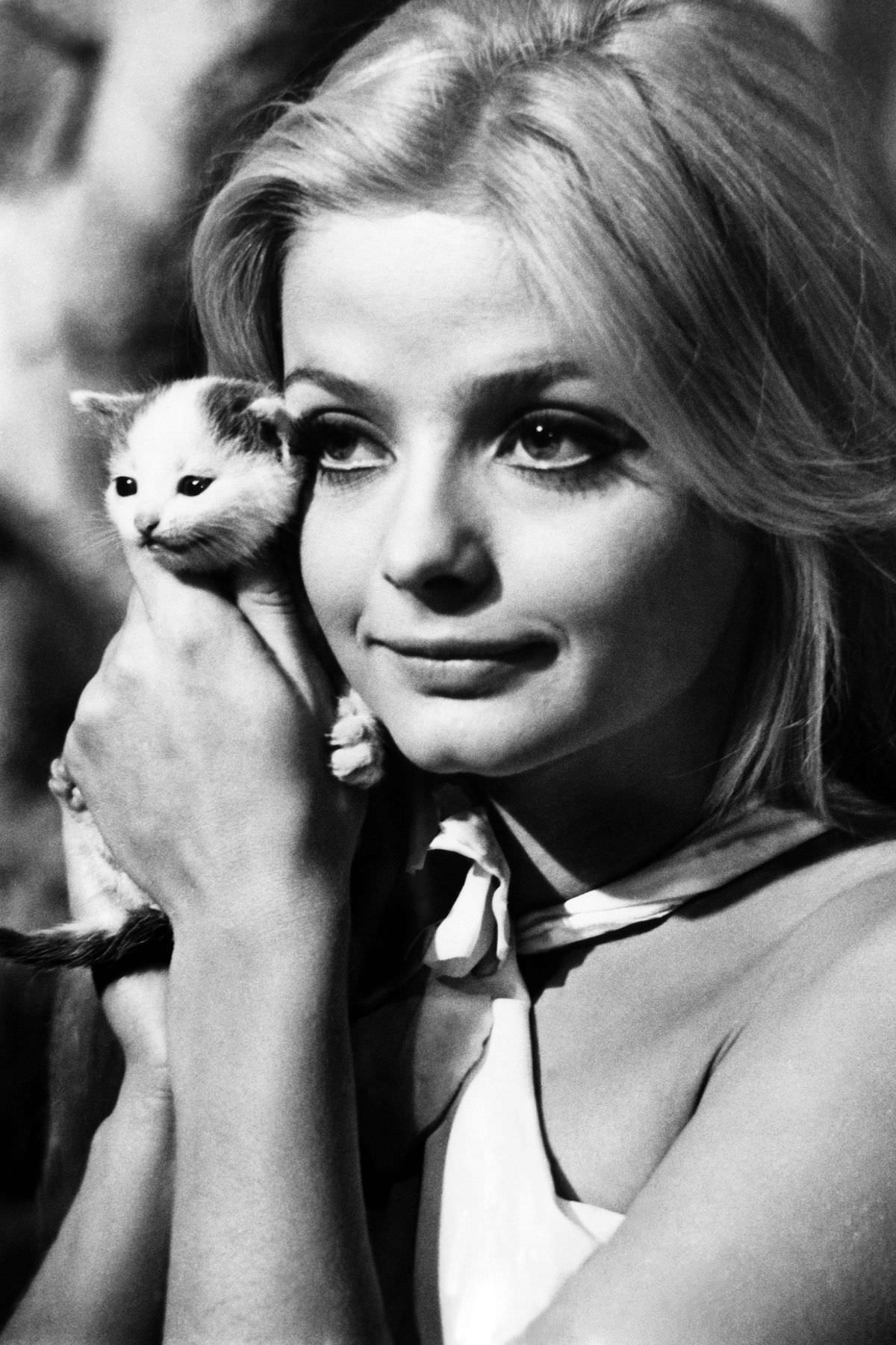 The Swedish actress Ewa Aulin posed with a minuscule feline named Hurricane in July 1968.