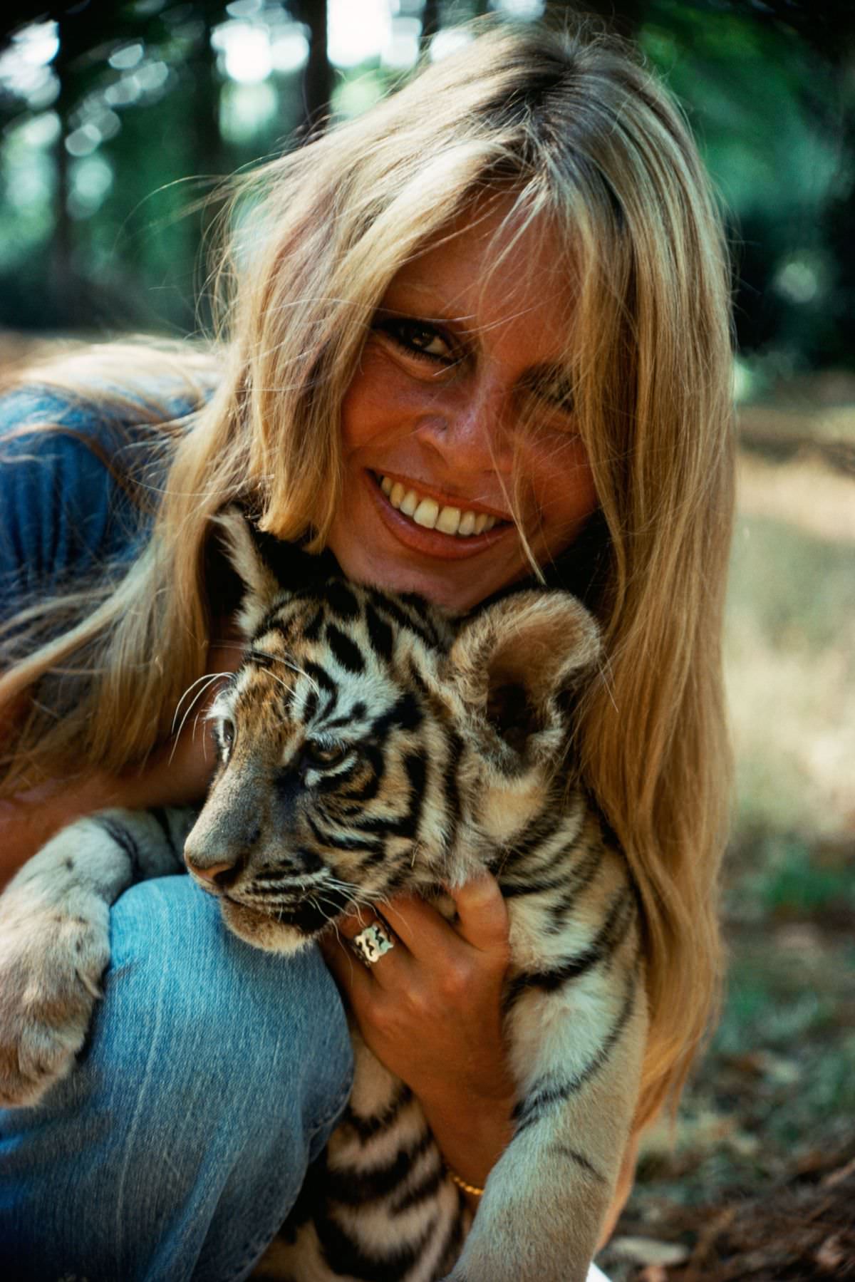 The French actress-singer Brigitte Bardot turned animal-rights activist cuddled with a tiger on a trip to Abidjan, Côte d'Ivoire, in 1976.