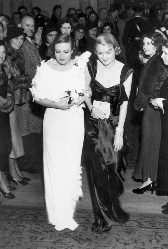 Constance Bennett with Joan Crawford arriving at the Mayfair Club Party at the Biltmore Hotel in Los Angeles, 1932.