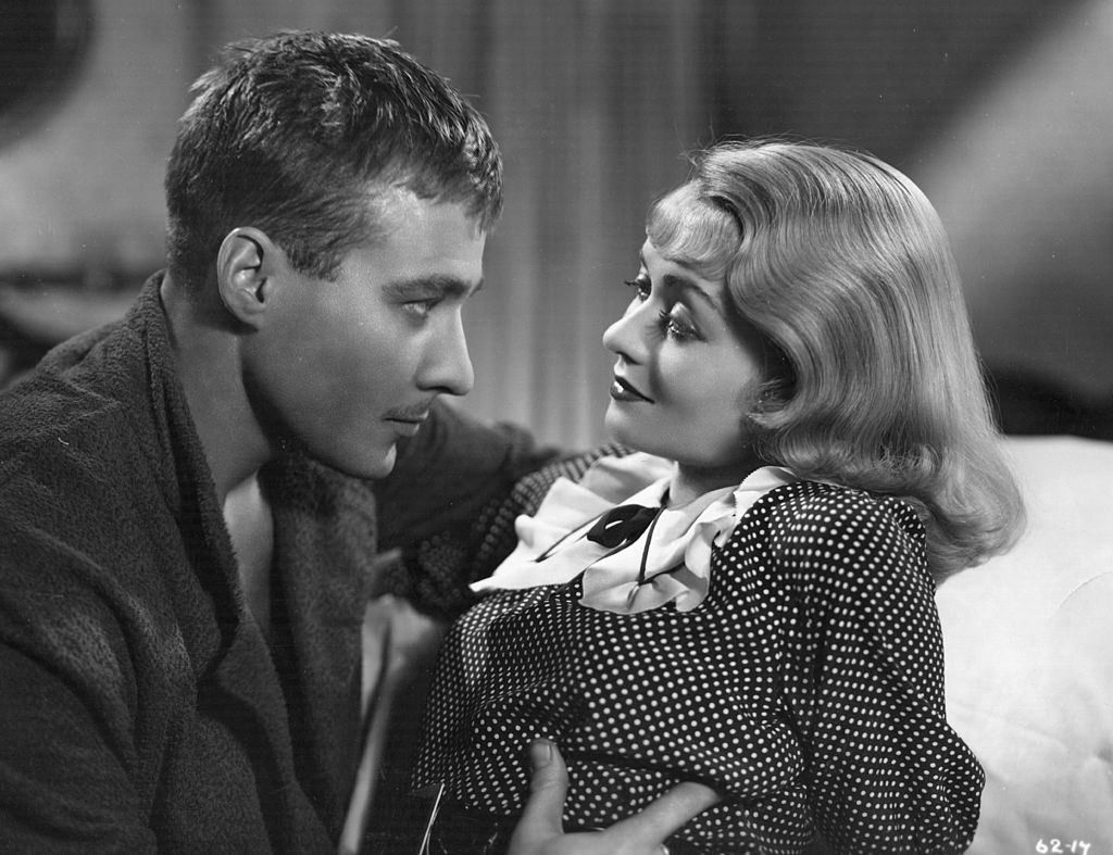 Constance Bennett with Douglass Montgomery in the film 'Everything Is Thunder', 1936.