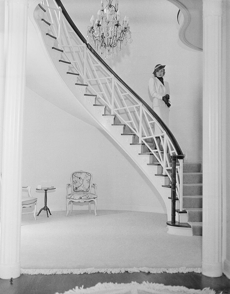 Constance Bennett pose inside her home in Los Angeles, 1940.