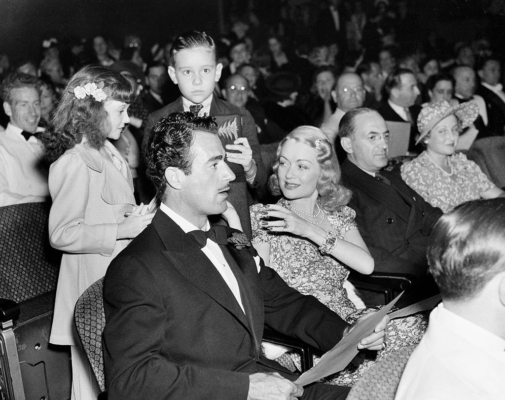 Constance Bennett with her husband actor Gilbert Roland and his children attend an event in Los Angeles, 1940.