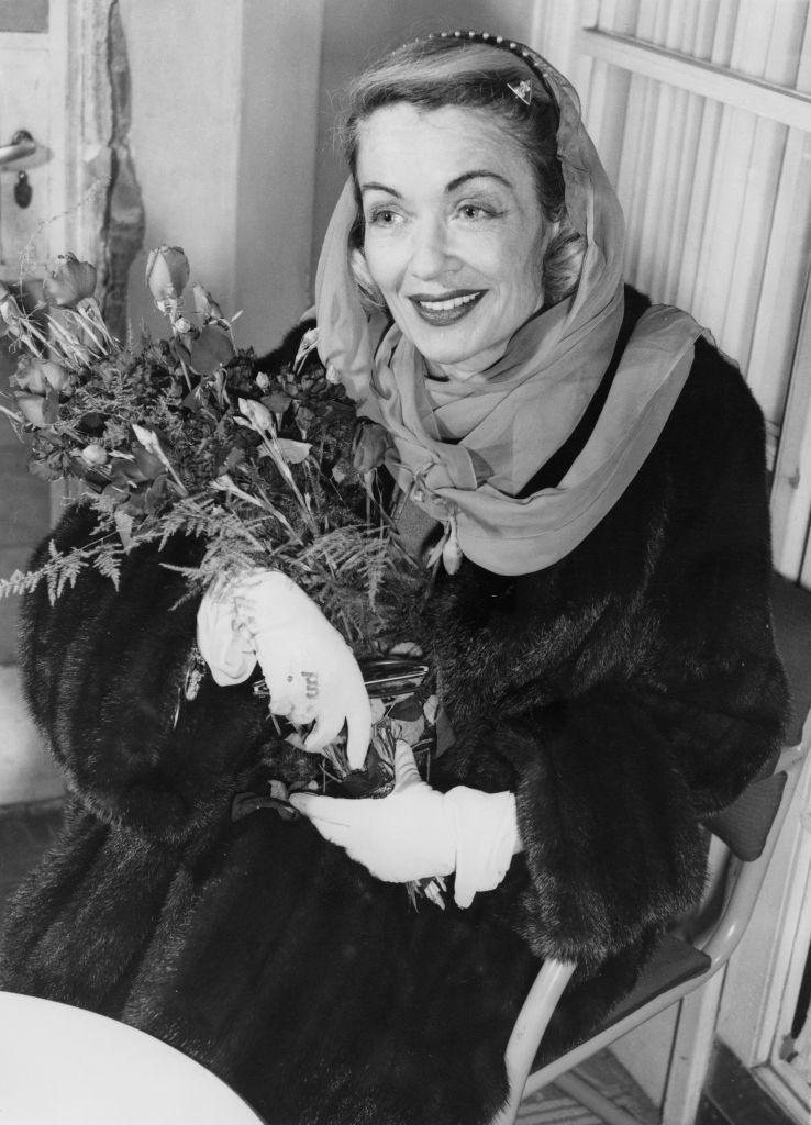 Constance Bennett after her arrival in London, 30th January 1957.