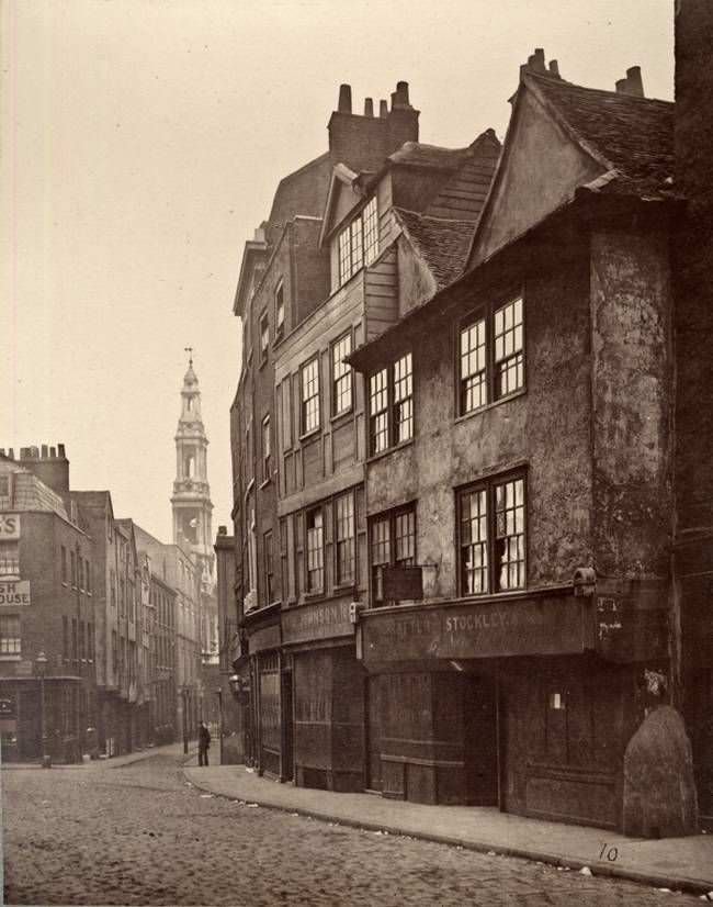 A man turns to look back in Drury Lane, 1876.