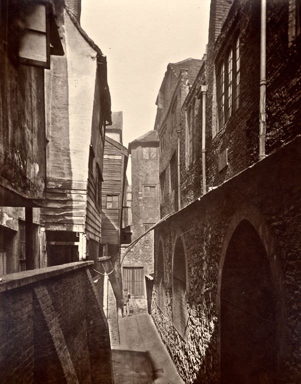 At the back of St Bartholomew’s, Smithfield, 1877.
