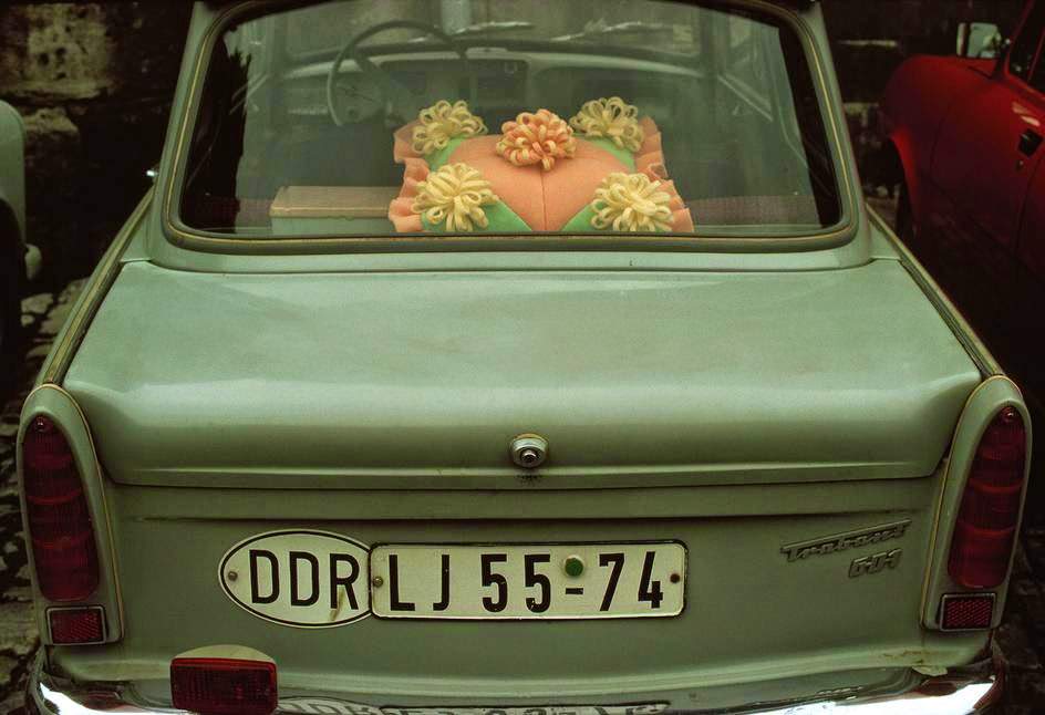 The rear window of a "Trabbi" (Trabant) car with a decorative plastic cushion. East Berlin