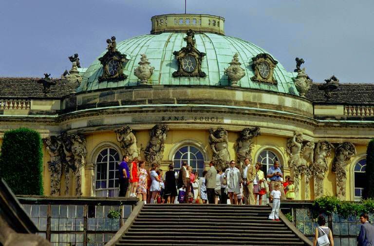 A group of visitors at Sanssouci castle and park in Potsdam.