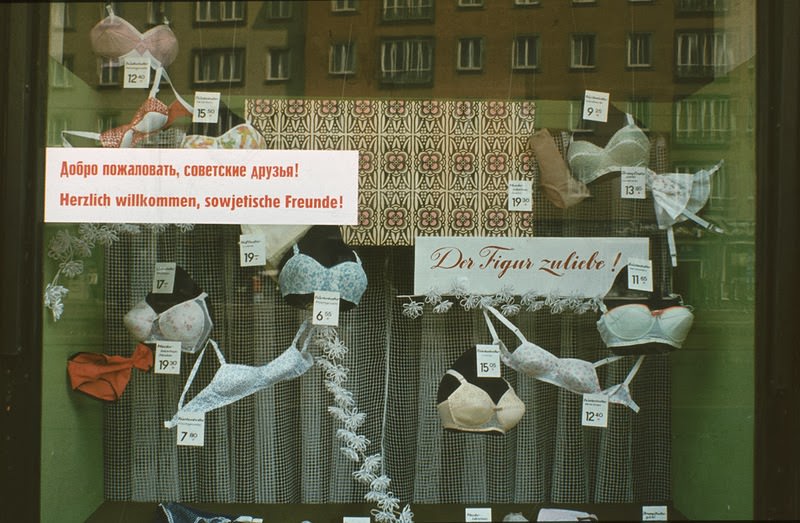 Shop window with poster: Welcome our sovier friends. It's the year of VIII. East Berlin, 1971.