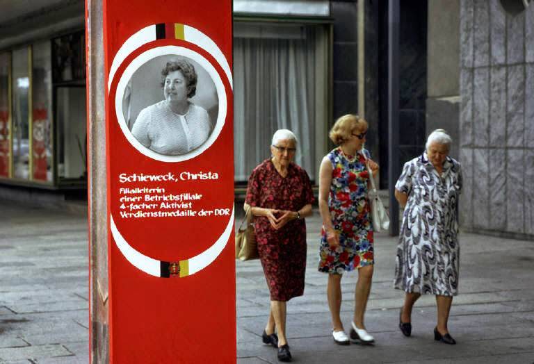 Three women walking on the sidewalk in Karl-Marx-Stadt (now Chemnitz). East Germany, Karl Marx Stadt.