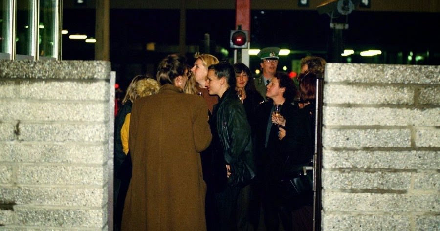 West Berlin citizens celebrate in the eastern part of the Checkpoint Charlie border crossing in West Berlin, Nov. 9, 1989