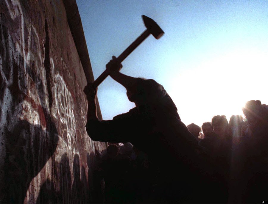 A man hammers away at the Berlin Wall, as the border barrier between East and West Germany was torn down after 28 years, in this Nov. 12, 1989 file picture.
