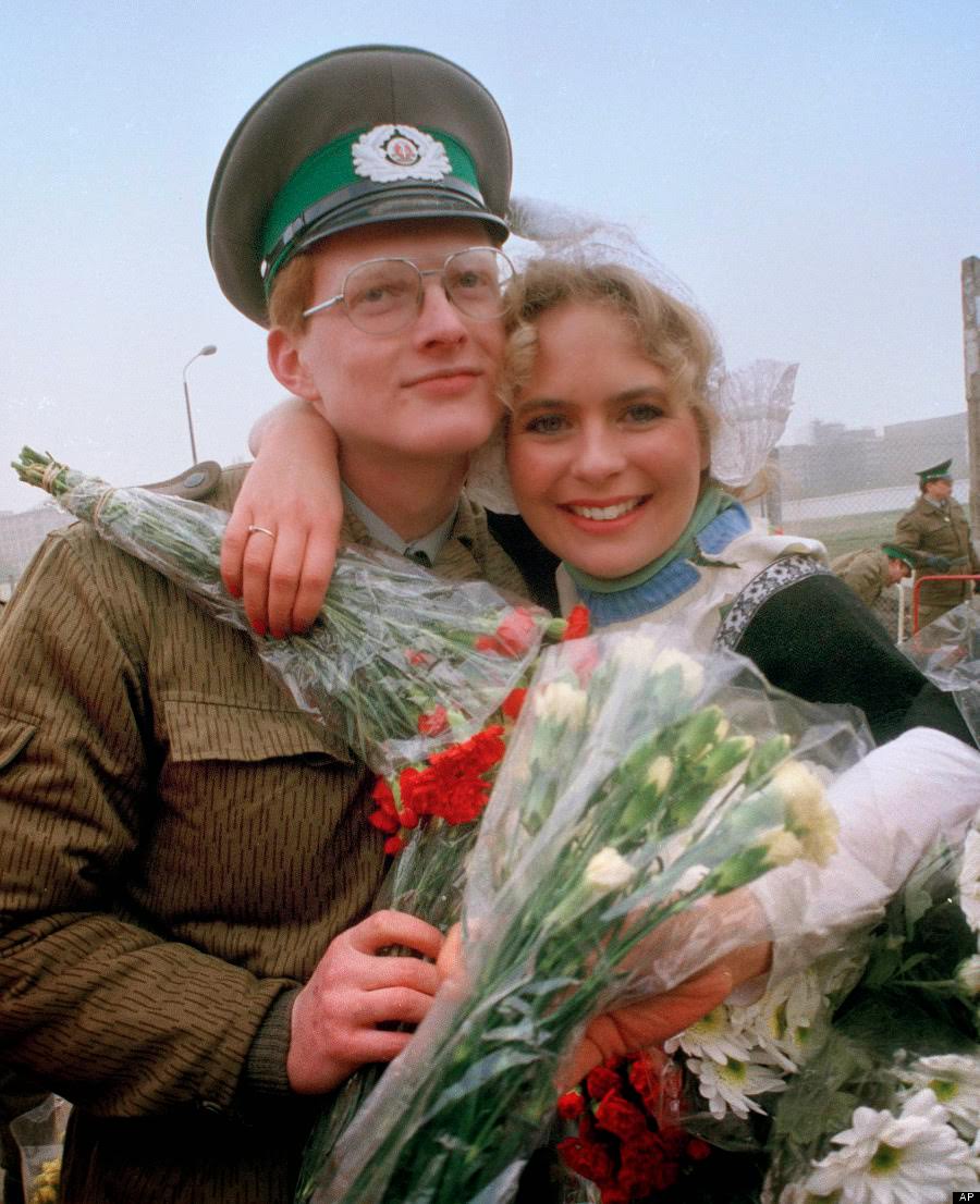 An East Berlin border guard is hugged by an unidentified Berliner at Potsdammer Platz, Nov. 12, 1989