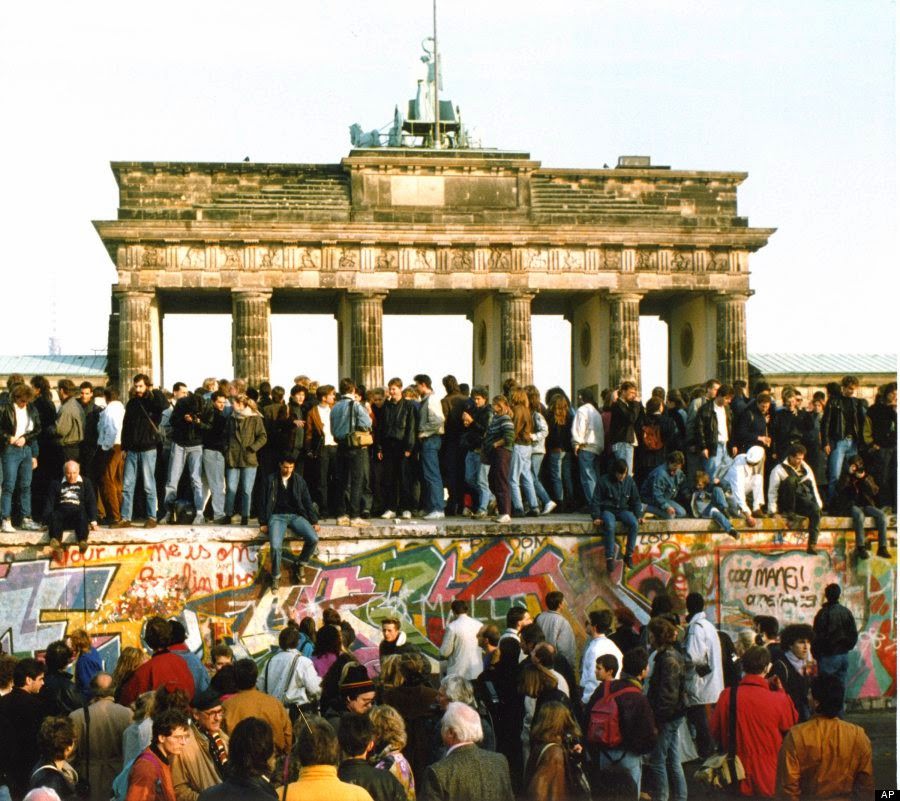 People climb on the Berlin wall on Nov. 10, 1989.