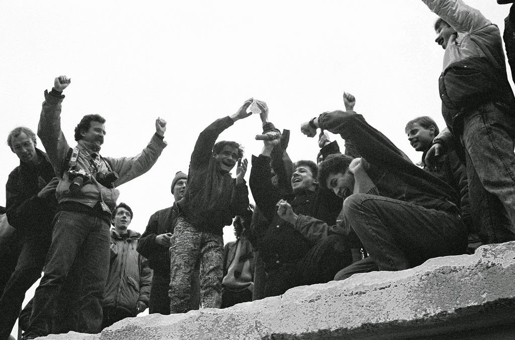 A view from the east of Berliners gathered on the Berlin Wall to celebrate the effective end of the city's partition, 31st December 1989.