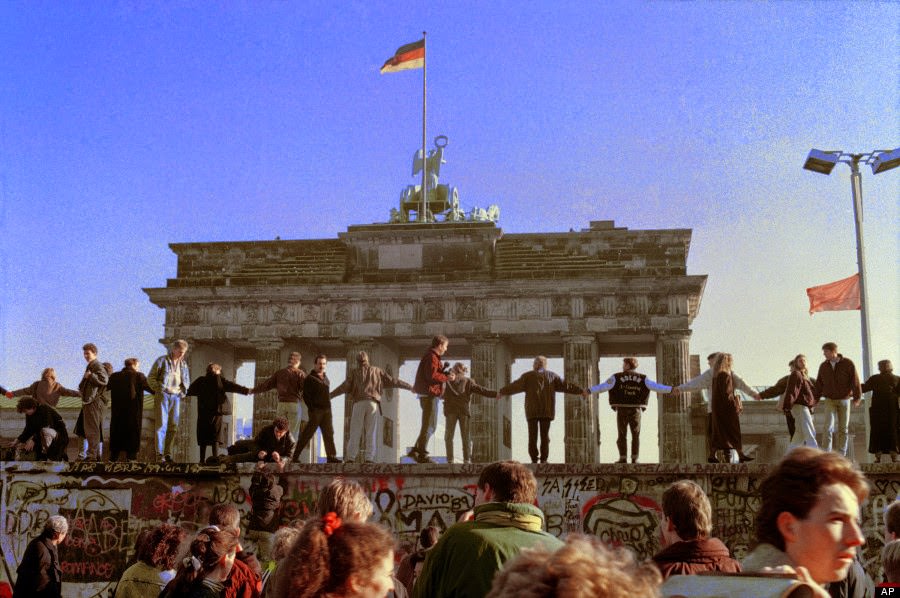 Berliners sing and dance on top of The Berlin Wall to celebrate the opening of East-West German borders in this Nov. 10, 1989 file picture.