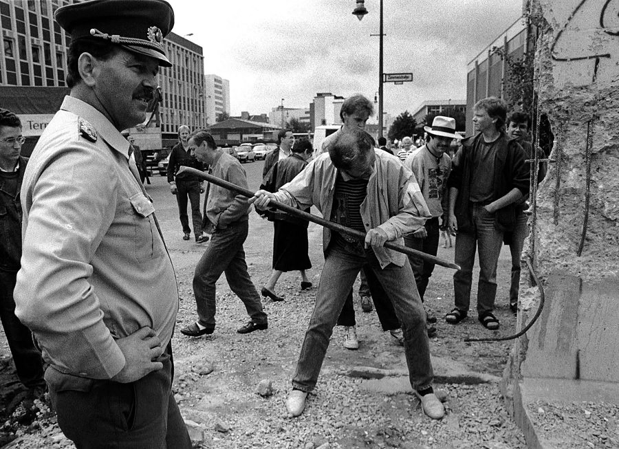 A man hammers away at Checkpoint Charlie June 2, 1990.