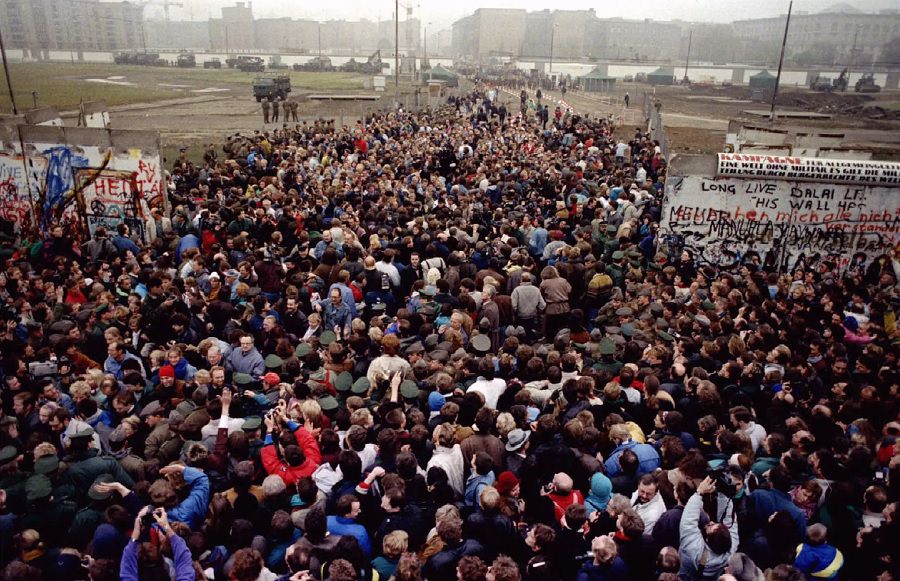 East Berliners cross and meet West Berliners at Potsdamer Platz after the Berlin Wall was torn down at this checkpoint November 12.
