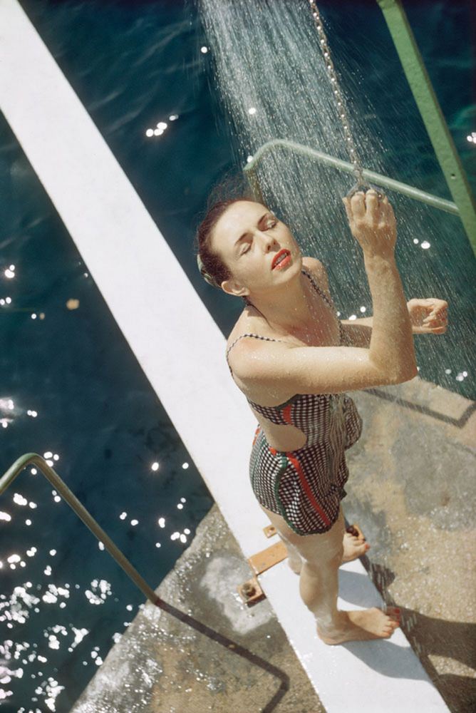 A girl from opio taking a shower, 1960s.