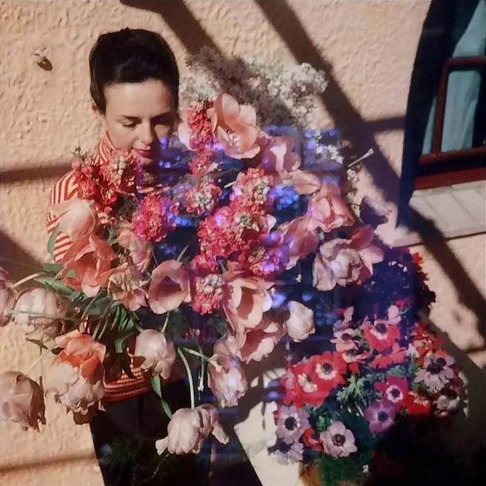 A girl with a bouquet of flower.