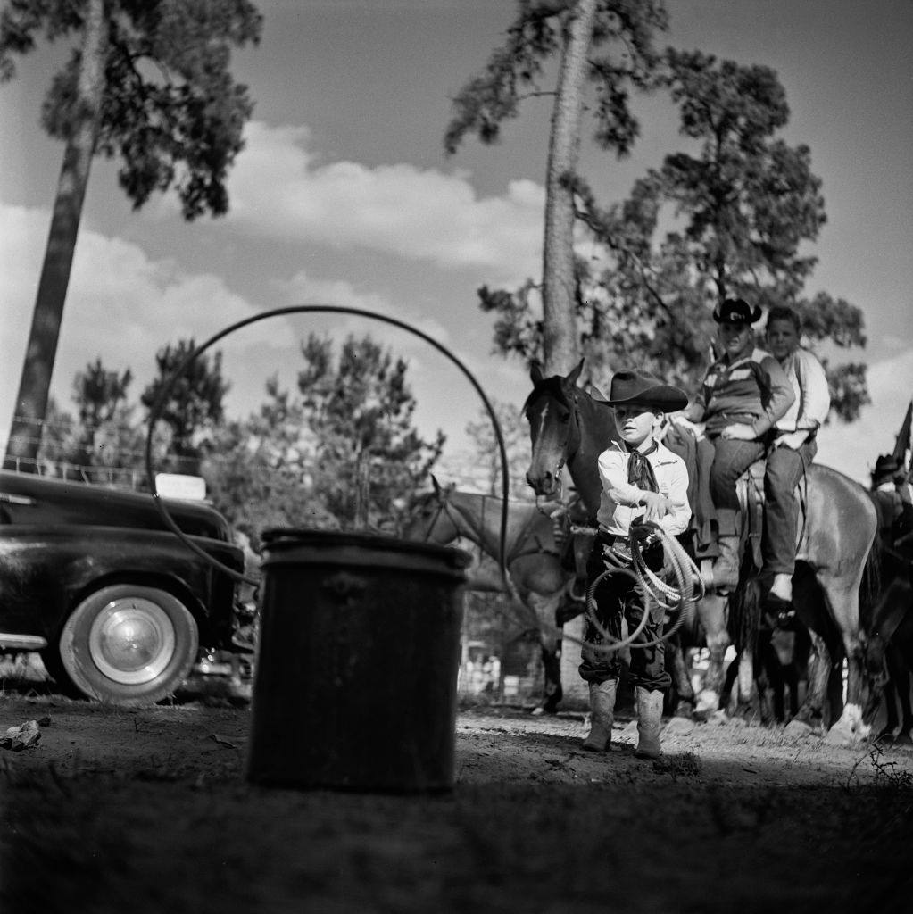 A young contestant practising with the lasso at a youth rodeo in Houston, Texas, 29th May 1952.