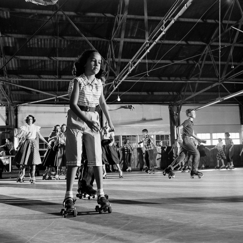 Child roller skating at party, Houston, Texas, 1954