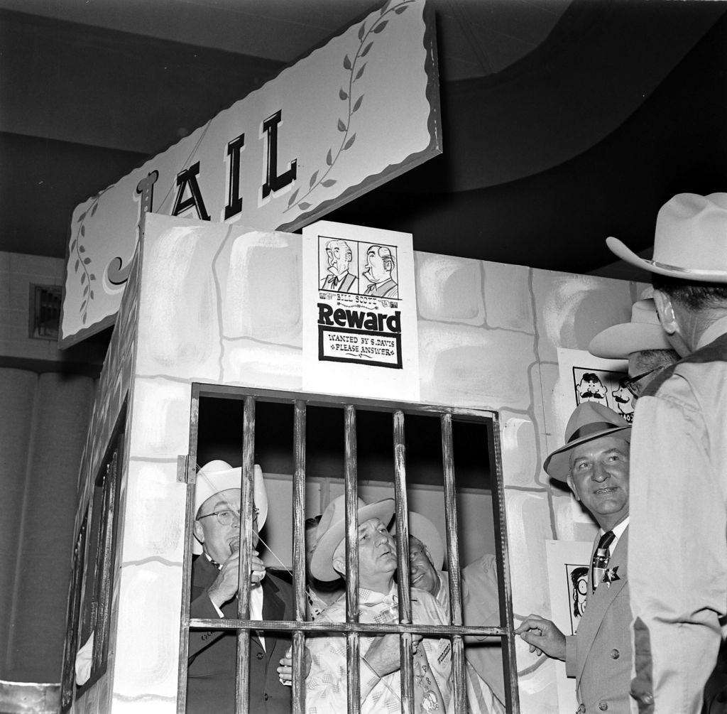 Men standing inside mock-up jail in Houston, Texas, 1953.