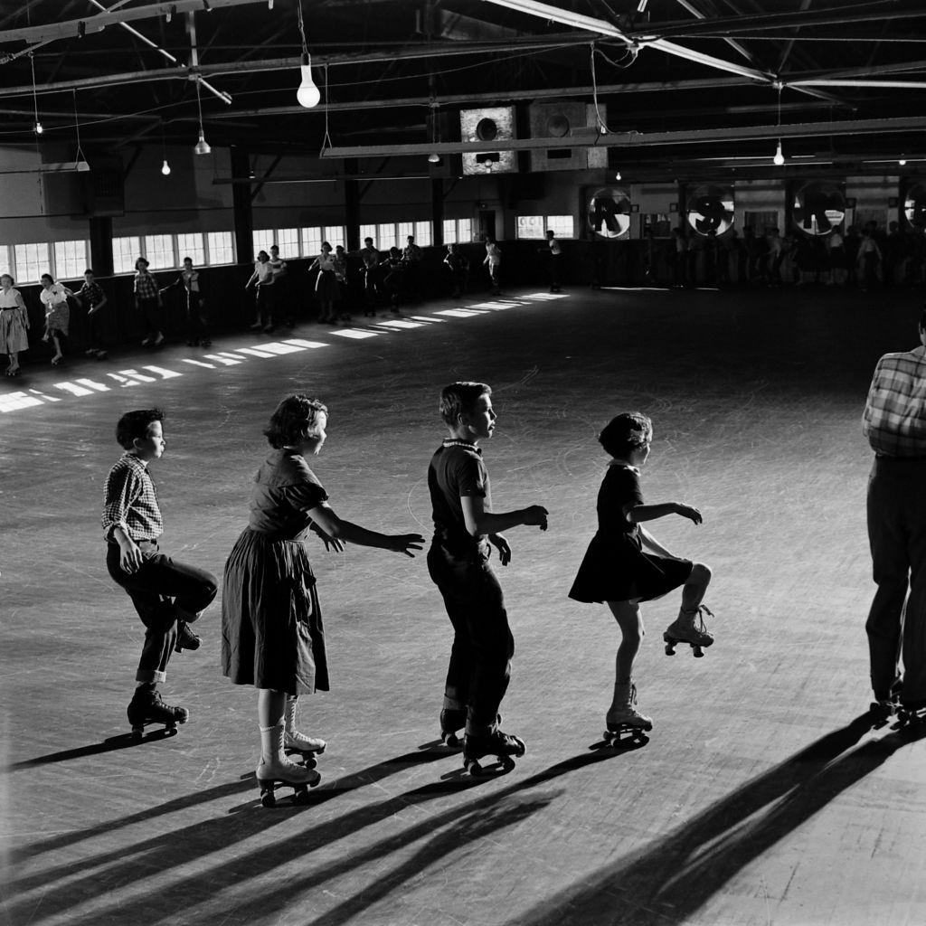 Children roller skating at party, Houston, Texas, 1954.