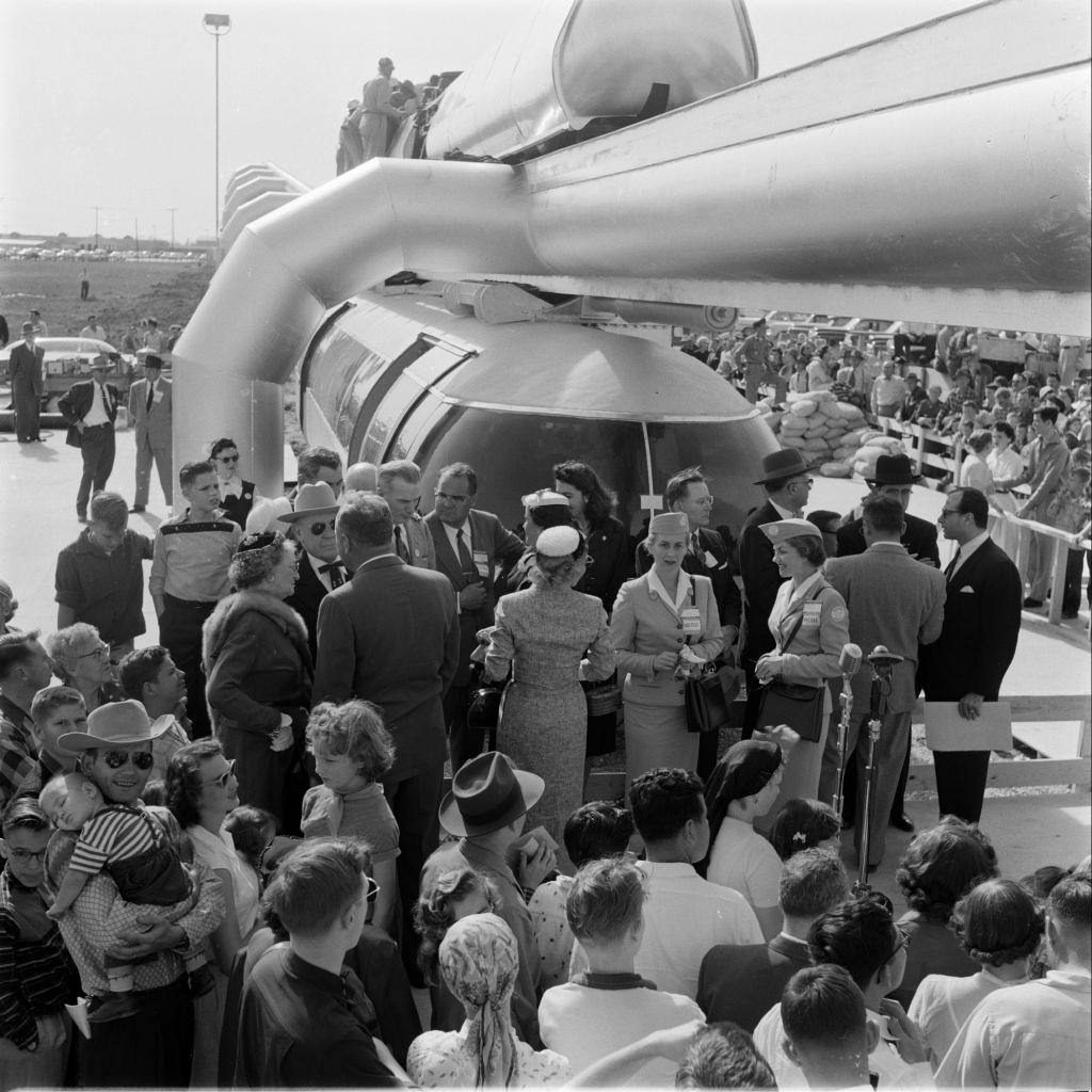People gathering near a monorail train, Houston, 1956.