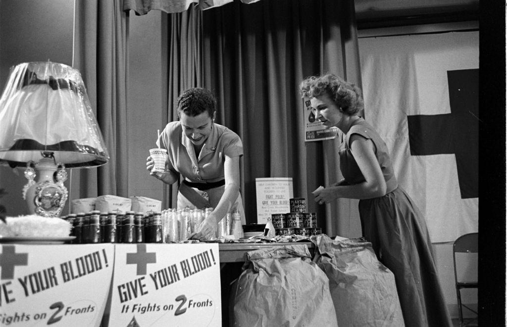 Women standing during blood donation, Houston, Texas, 1953.